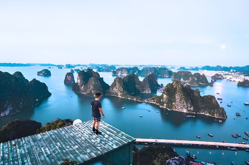 Bai Tho Poem Mountain and the karst islands at the entrance to Halong Bay Bai Tho Poem Mountain and the karst islands at the entrance to Halong Bay
