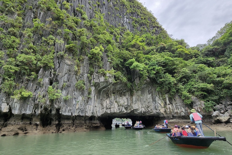 Traditional bamboo rowboat at the entrance to Luon Cave