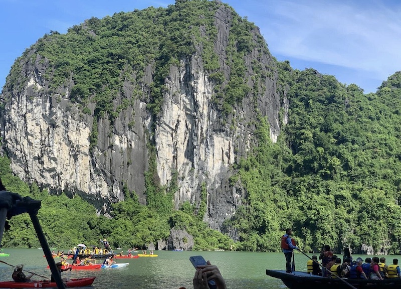 Limestone cliffs and vegetation around the Luon Cave lagoon