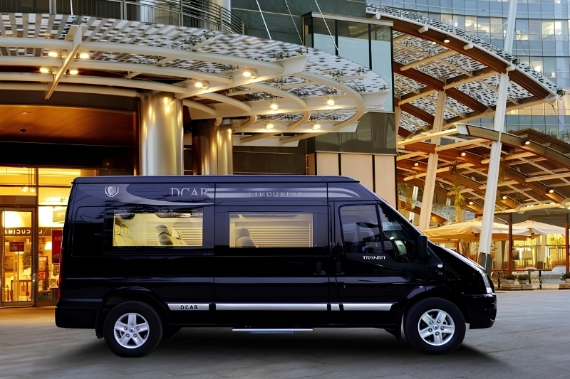Modern interior of a luxury shared limousine van with plush leather reclining seats, ideal for transfers to Ninh Binh.