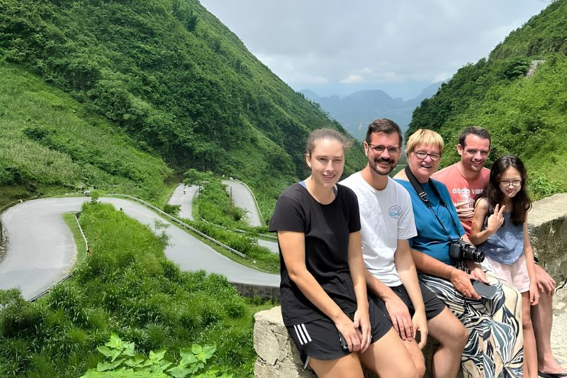 Travelers at a viewpoint on Ma Pi Leng Pass