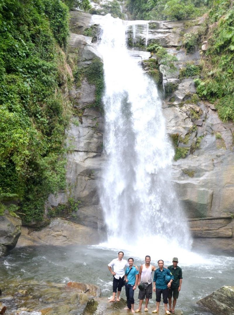 Visitors at the base of a tier of Luong Waterfall