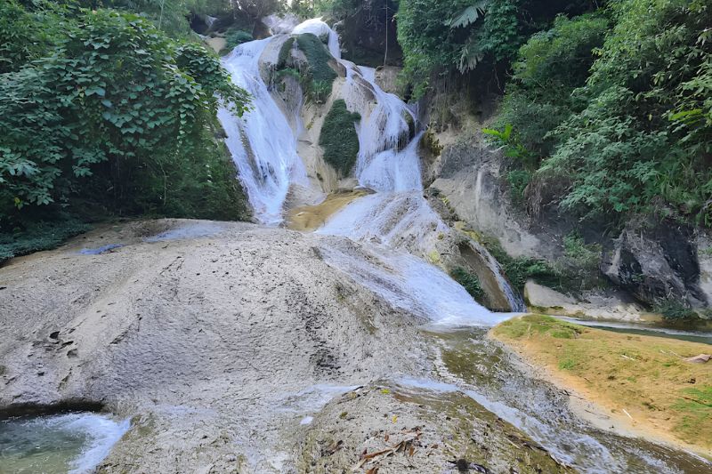 Cascades of Nam Tau Waterfall in the forest