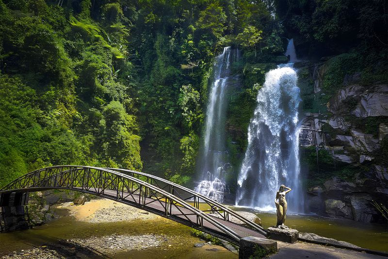 Tien Waterfall at Deo Gio with a footbridge over the stream